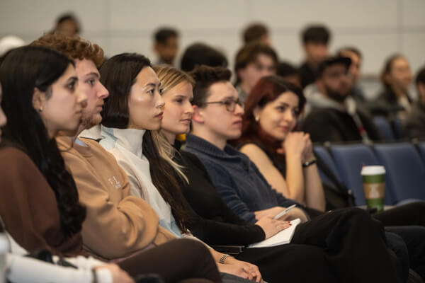 students listen intently in the audience at the Brad Wolff Consulting360 event
