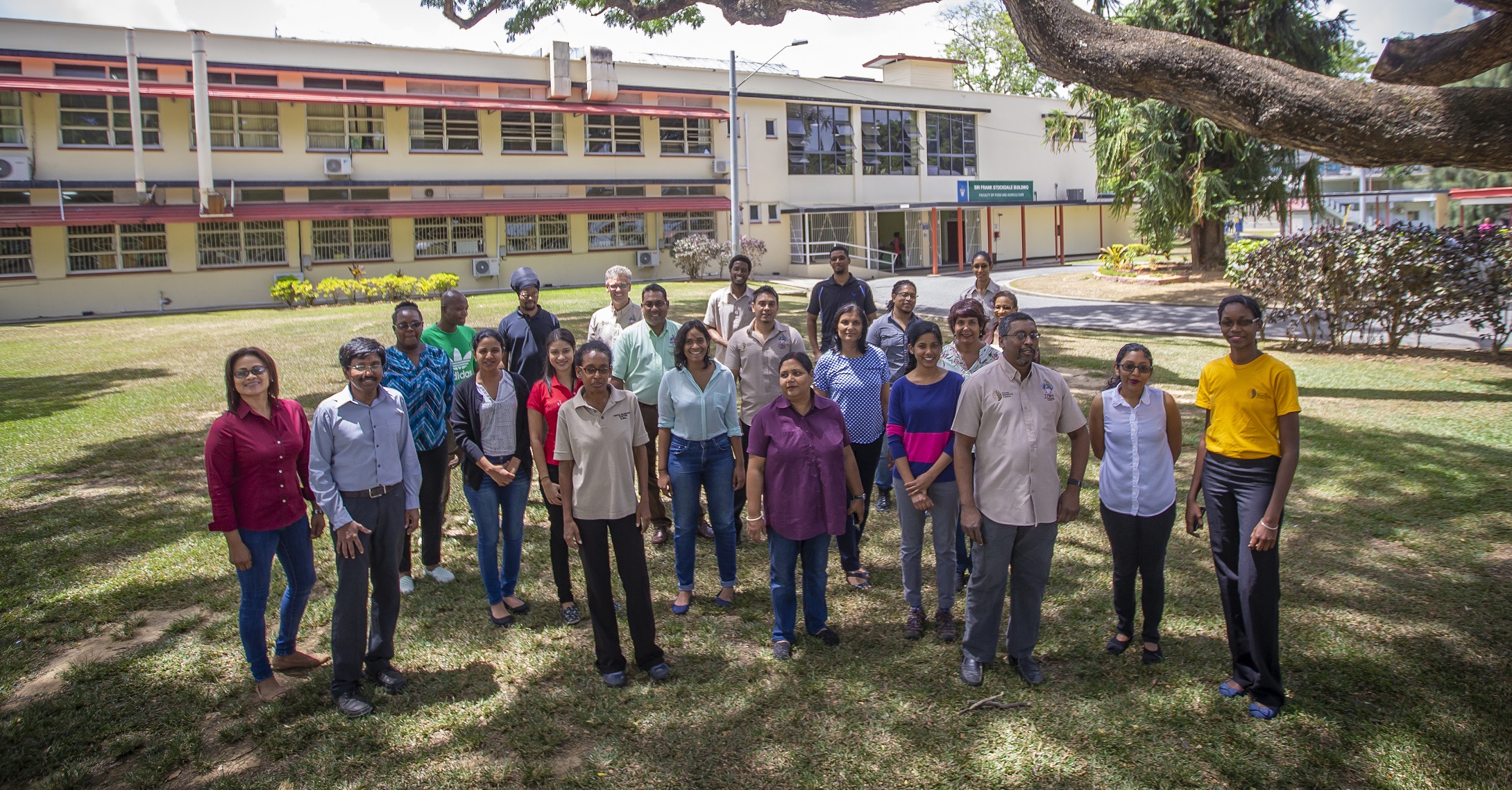 Researchers gather for a photo on the front lawn of the Cocoa Research Center at the University of the West Indies in Trinidad & Tobago
