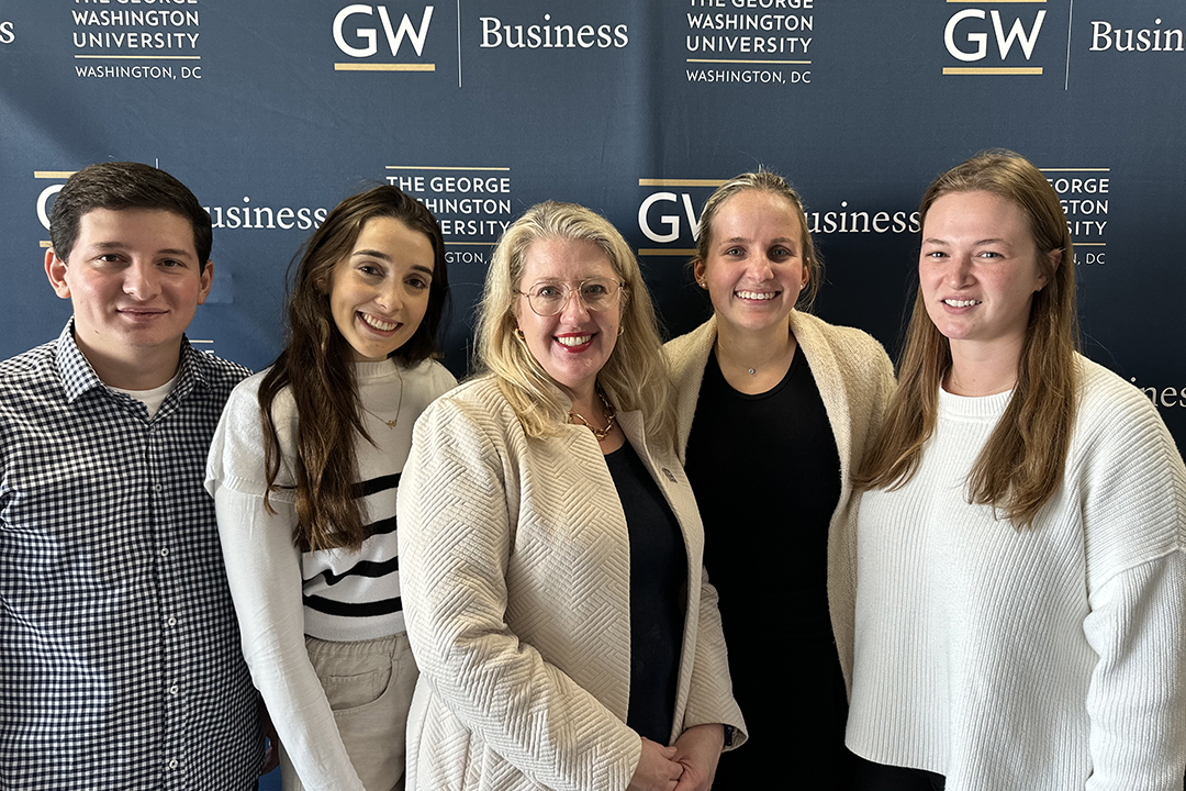 GWSB Professor Bonnie Pierce (center) pictured with some of her Fall 2023 capstone students