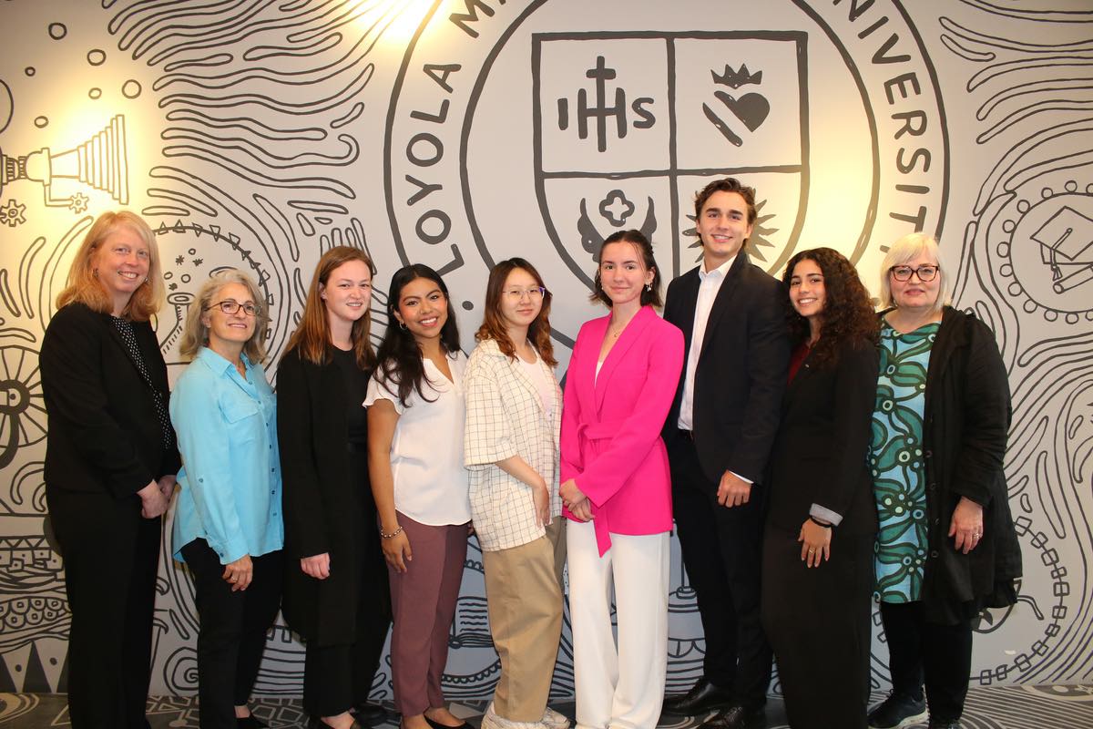Director of GW-CIBER Anna Helm (right) with GW students