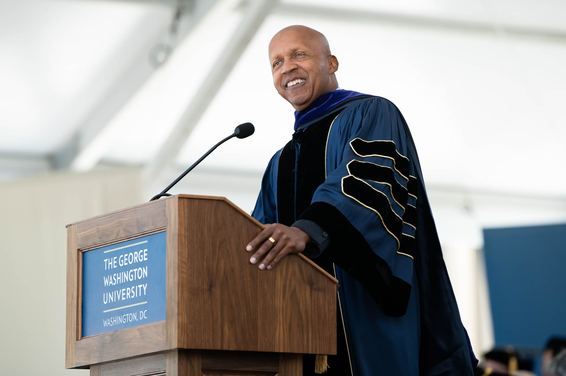 Commencement speaker Bryan Stevenson speaking at podium