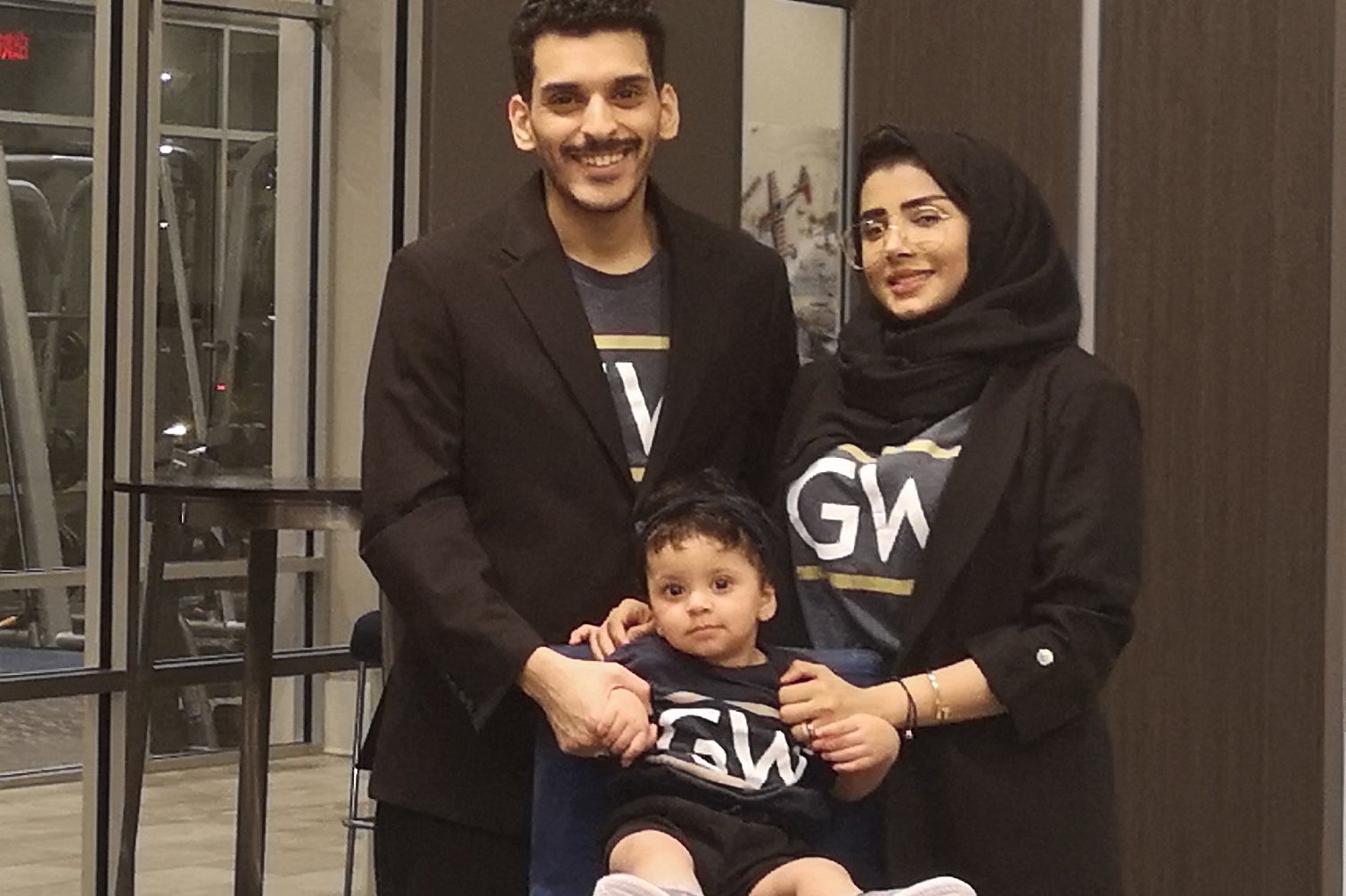 Mohamad Alahdal, Rahaf Alamoudi and their daughter Ayla sporting GW gear.