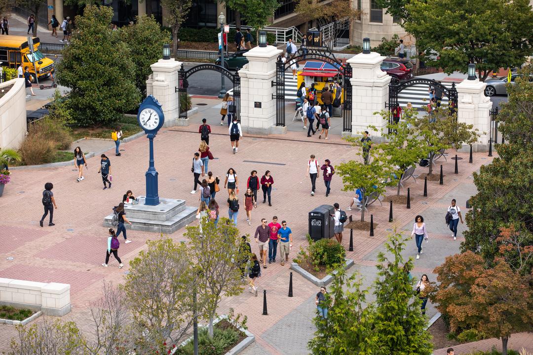 Aerial shot of a student-filled Kogan Plaza during the day