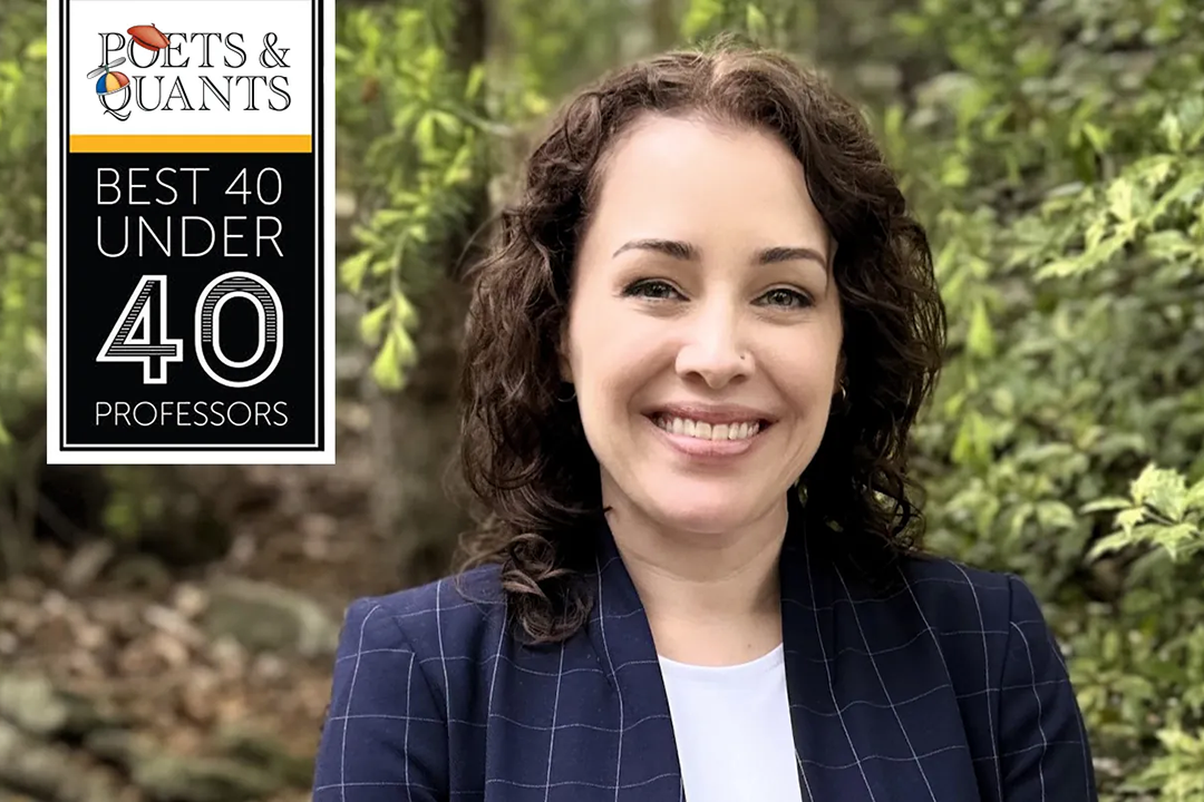 Poets & Quants Best 40 Under 40 Professors. Image shows GW Professor Vontrese Pamphile. Trees are visible in the photo background.