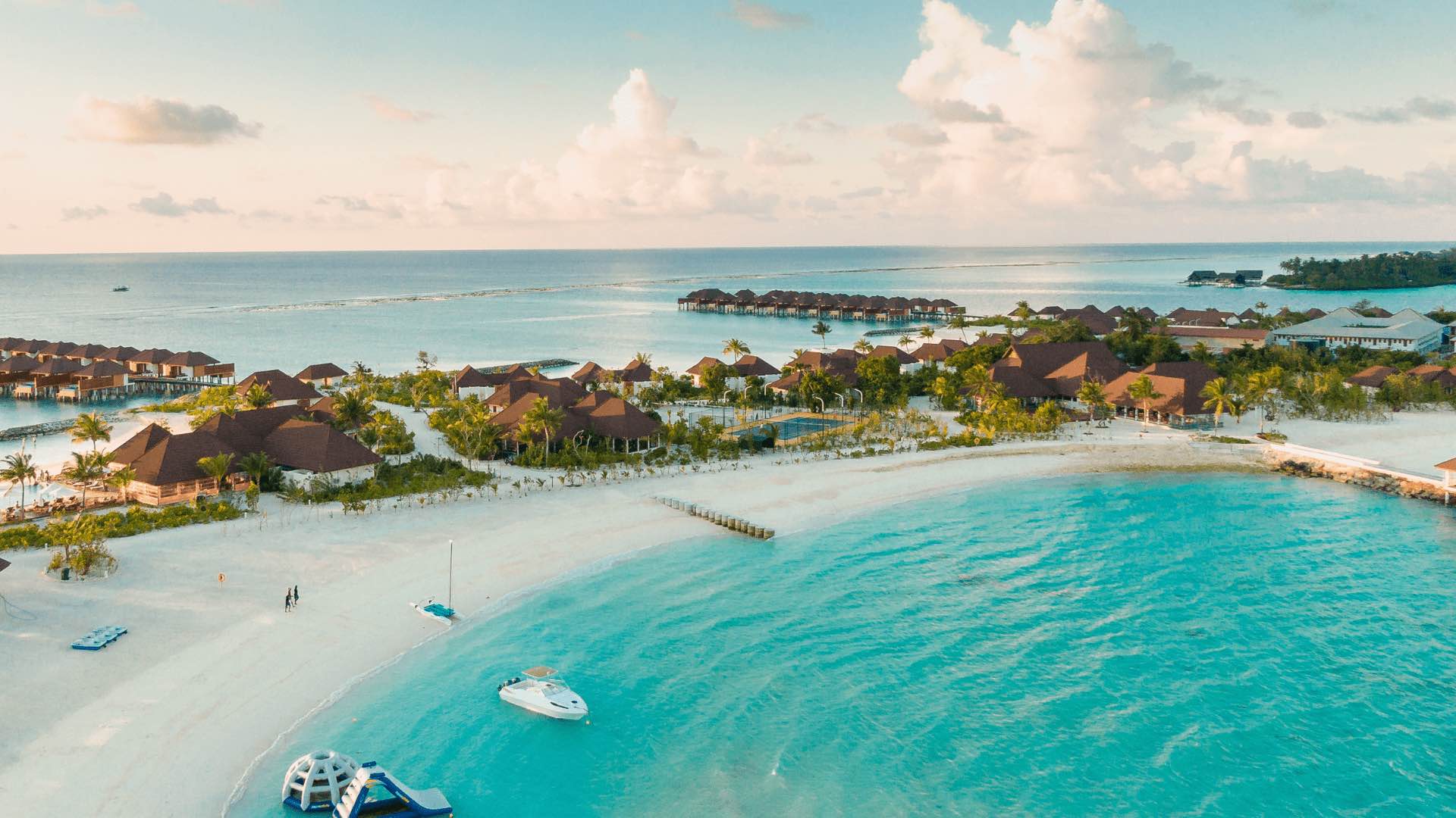 Aerial view of an island resort with a number of villas