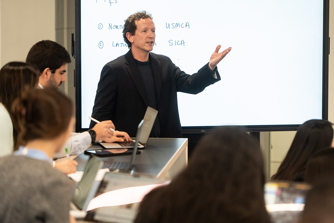 a GWSB professor leads a class in a discussion about AI