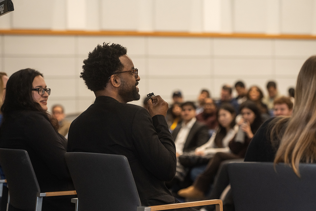 a man speaks as part of a panel during a GWSB career center event