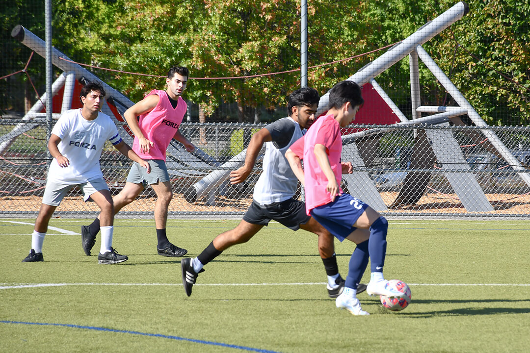 players of the pink and white teams during the inaugural Buff & Blue Cup