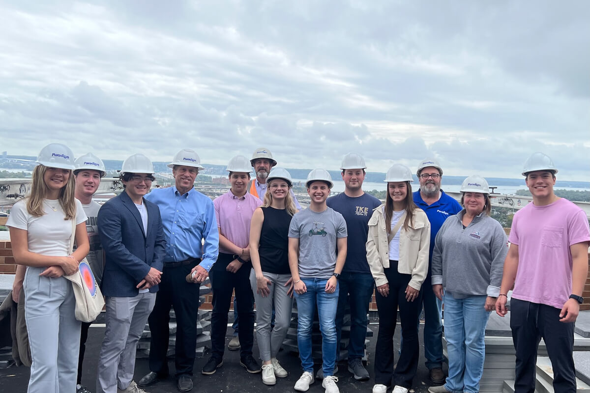 GWSB alumnus Stanley Sloter, president and CEO of Paradigm Companies (pictured fourth from left) leads students on a tour of a site his organization is developing.