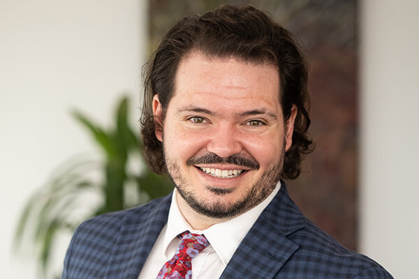 close up of male student smiling directly at the camera