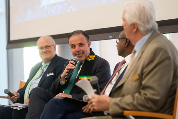 a diverse group of 4 panelists at event