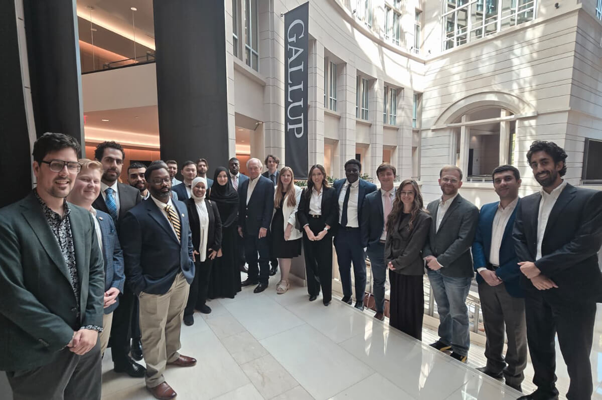 attendees of the site visit to the Gallup Foundation pose for a group photo