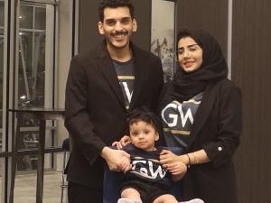 Mohamad Alahdal, Rahaf Alamoudi and their daughter Ayla sporting GW gear.