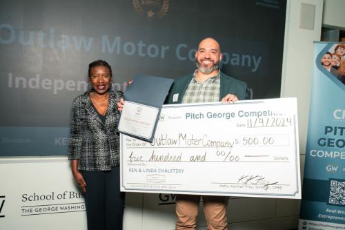 members of the student entrepreneur team Outlaw Motor Company pose for a photo after winning a category in the 2024 Pitch George competition