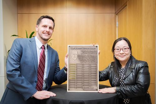 Rafel Lucea Global Experiential Fund students at GWSB pose for a photo with a bronze award plaque
