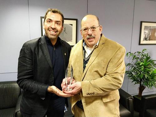 Dr. George Solomon accepts the Ray Smilor Award