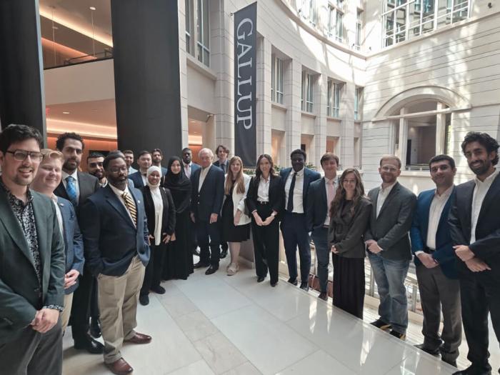 attendees of the site visit to the Gallup Foundation pose for a group photo