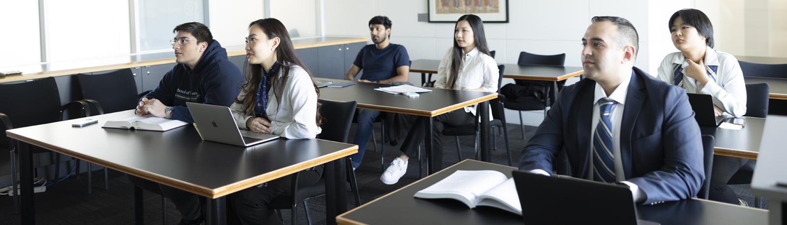 a small group of students attends a networking class at the GW School of Business