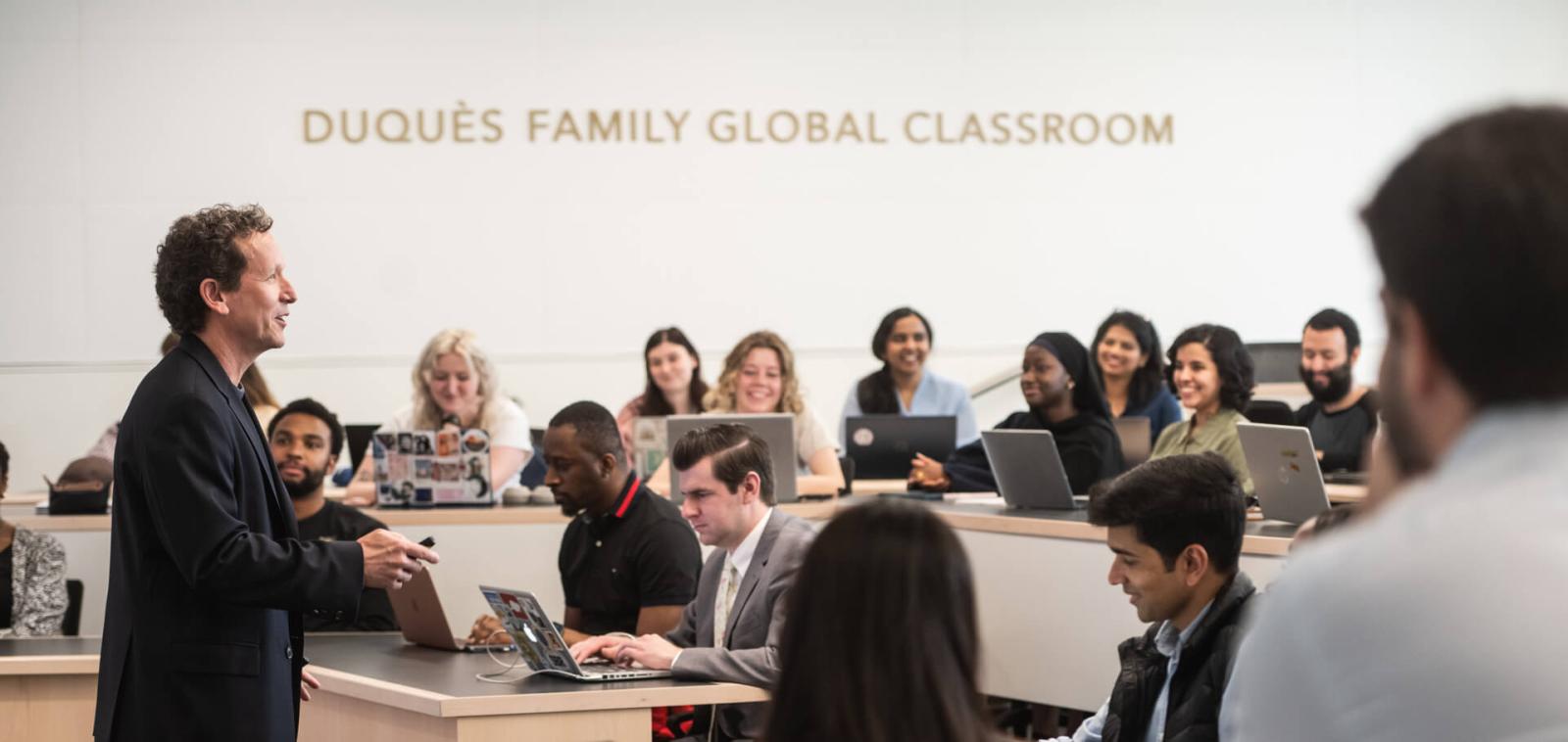 professor teaches to auditorium style seating class