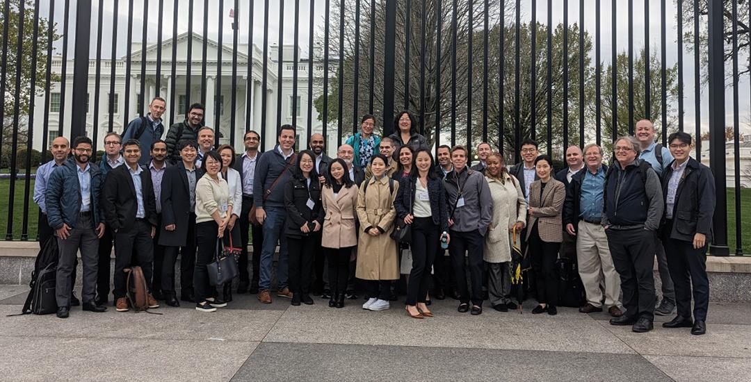 GWSB 2023 Cherry Blossom Conference attendees pose in front of the White House