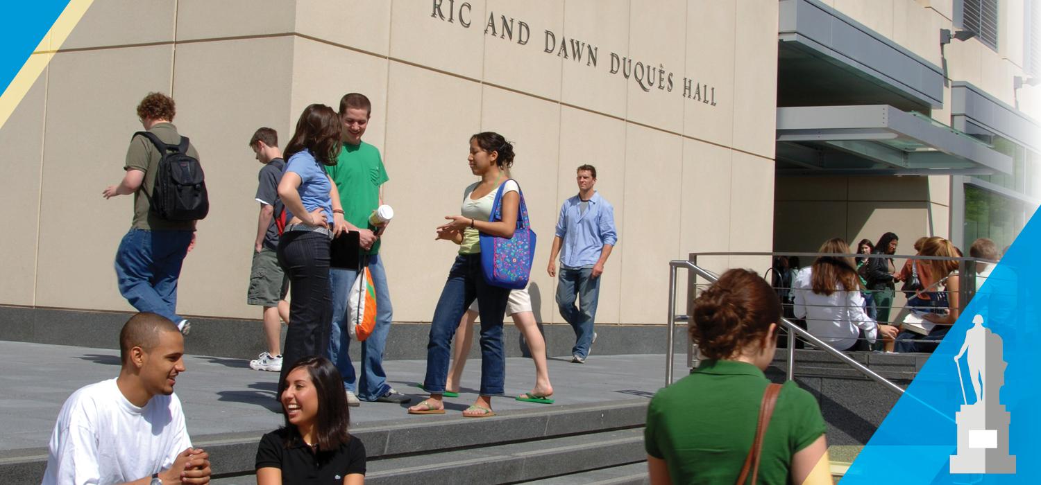 Students gathering outside of Duques Hall, the home of GWSB
