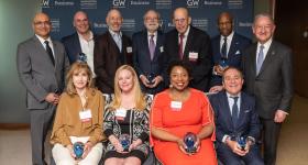 GWSB Entrepreneurial Hall of Fame inductees pose for a photo with GW President Mark S. Wrighton and GW School of Business Dean Anuj Mehrotra