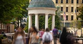 Students pass by the tempietto in Kogan Plaza