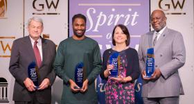 Steven V. Roberts, Nassirou Diallo, Christine Brown-Quinn and Joseph Wright posing with their Spirit of GW awards