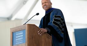 Commencement speaker Bryan Stevenson speaking at podium