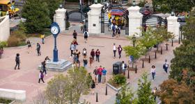 Aerial shot of a student-filled Kogan Plaza during the day