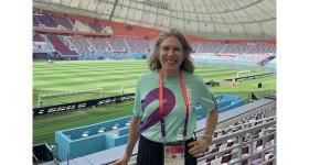 Lisa Delpy Neirotti at a sports arena