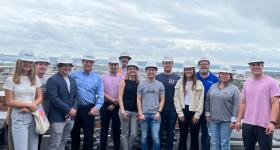 GWSB alumnus Stanley Sloter, president and CEO of Paradigm Companies (pictured fourth from left) leads students on a tour of a site his organization is developing.
